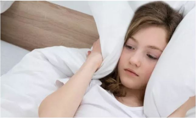 woman in bed not sleeping